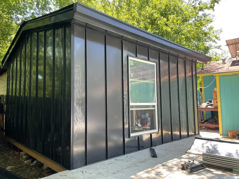 Black standing seam metal wall panels for Metal Roof Installation in Logansport